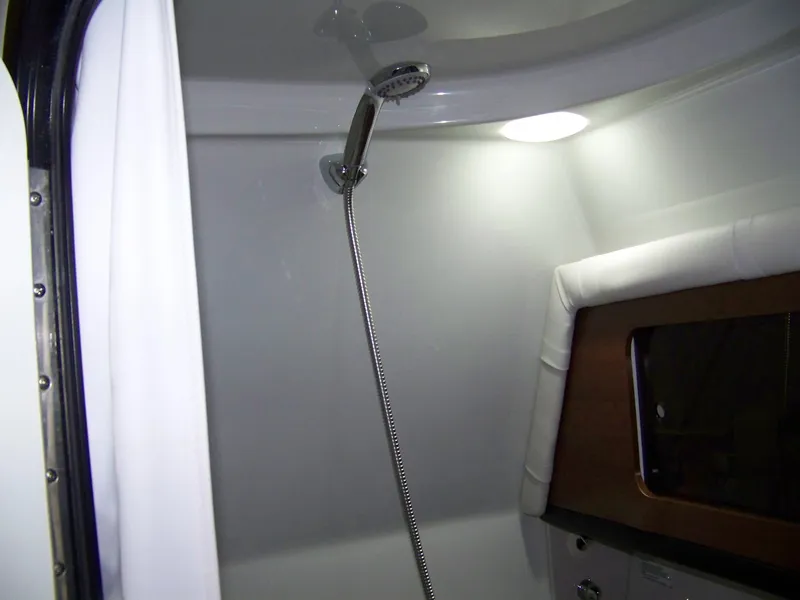 Slide: The Image of Interior shower area of 2020 Crownline 350 SY boat, featuring modern fixtures. - 31