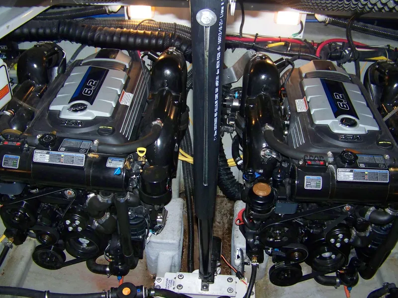 Slide: The Image of Twin engines in a 2020 Crownline 350 SY boat engine room. - 32
