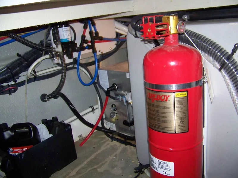 Slide: The Image of Engine compartment of 2020 Crownline 350 SY with fire extinguisher and wiring. - 36