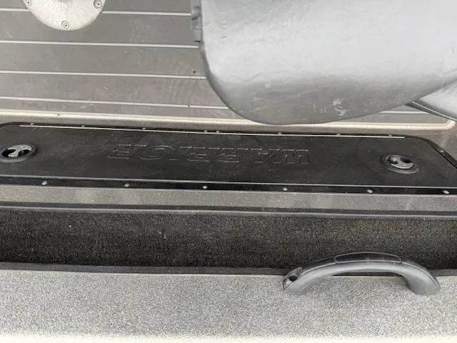 Slide: The Image of 2016 Warrior V2090 boat storage compartment with handle and black cover. - 11