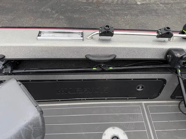 Slide: The Image of 2016 Warrior V2090 boat interior with storage compartment and mounted equipment. - 13