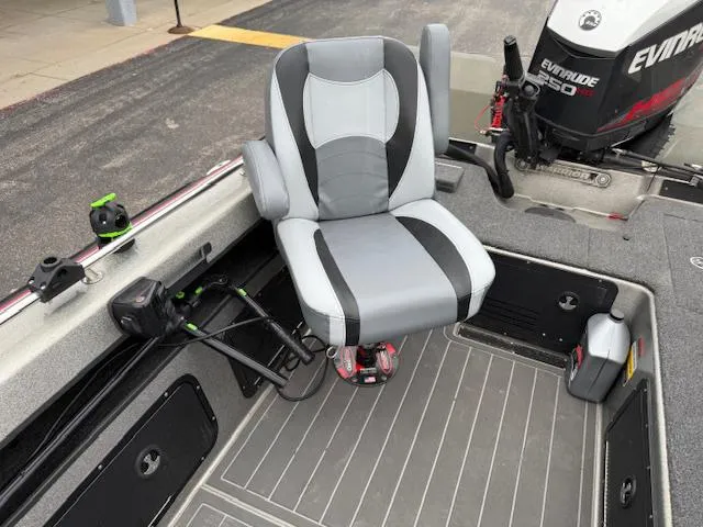 Slide: The Image of 2016 Warrior V2090 boat interior with swivel seat and Evinrude motor. - 14