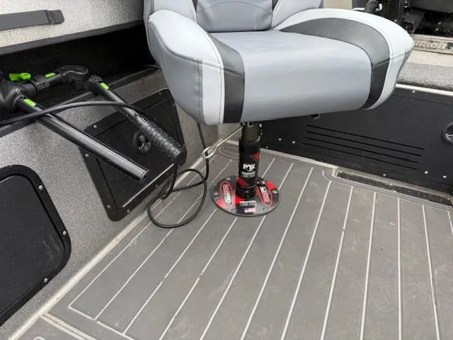 Slide: The Image of Gray interior of 2016 Warrior V2090 boat with swivel seat and fishing rod holders. - 15