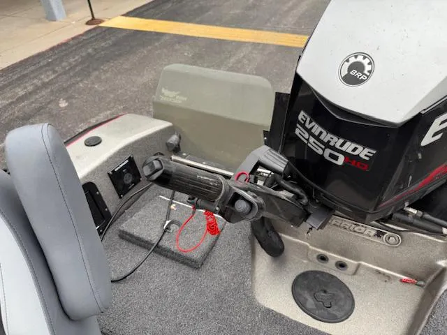 Slide: The Image of 2016 Warrior V2090 boat with Evinrude 250 HP motor, featuring steering controls. - 17