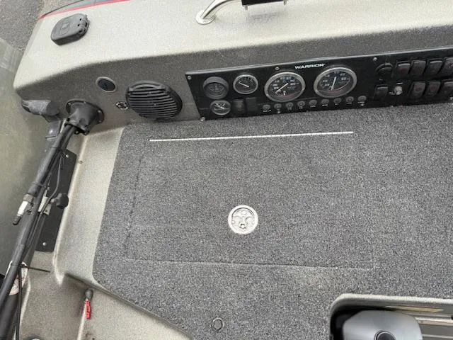 Slide: The Image of 2016 Warrior V2090 boat dashboard with gauges and carpeted surface. - 18
