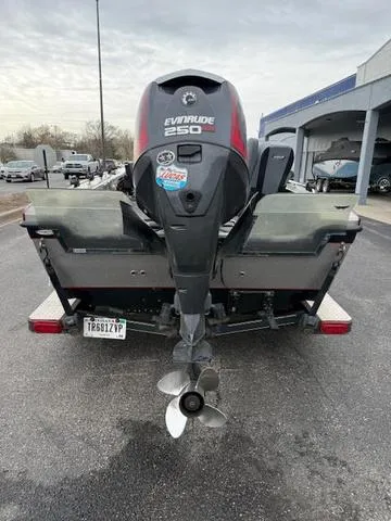Slide: The Image of 2016 Warrior V2090 boat with Evinrude 250 engine, parked outdoors. - 3