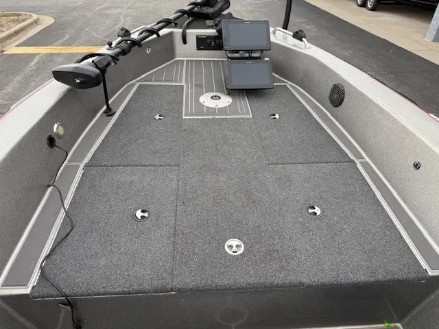 Slide: The Image of 2016 Warrior V2090 boat deck with dual screens and fishing rod holders. - 6