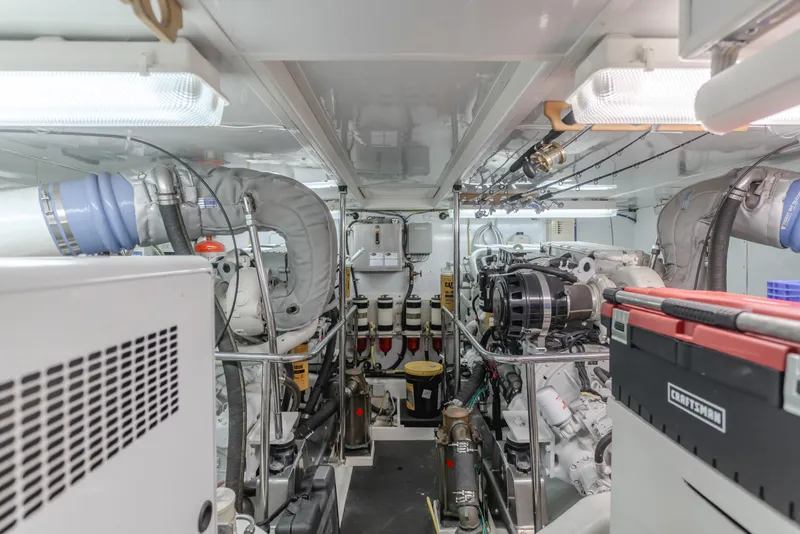 Slide: The Image of Engine room of 2005 Ocean Alexander 548 Pilothouse yacht, showcasing mechanical components and systems. - 13