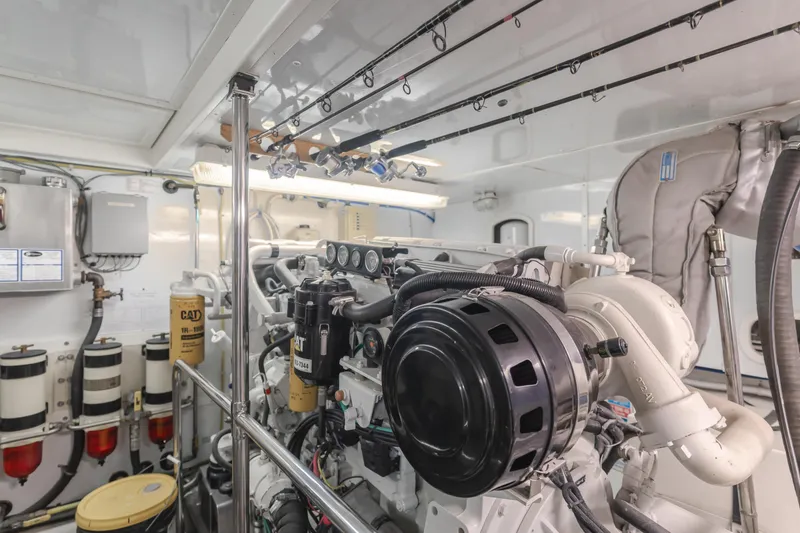 Slide: The Image of Engine room of 2005 Ocean Alexander 548 Pilothouse yacht, showcasing mechanical components. - 14