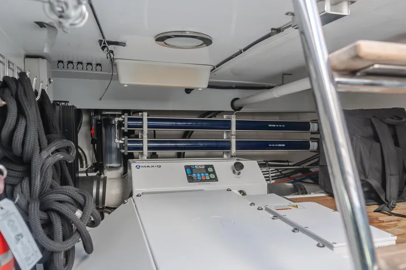 Slide: The Image of Engine room of 2005 Ocean Alexander 548 Pilothouse yacht, featuring mechanical equipment and storage. - 17