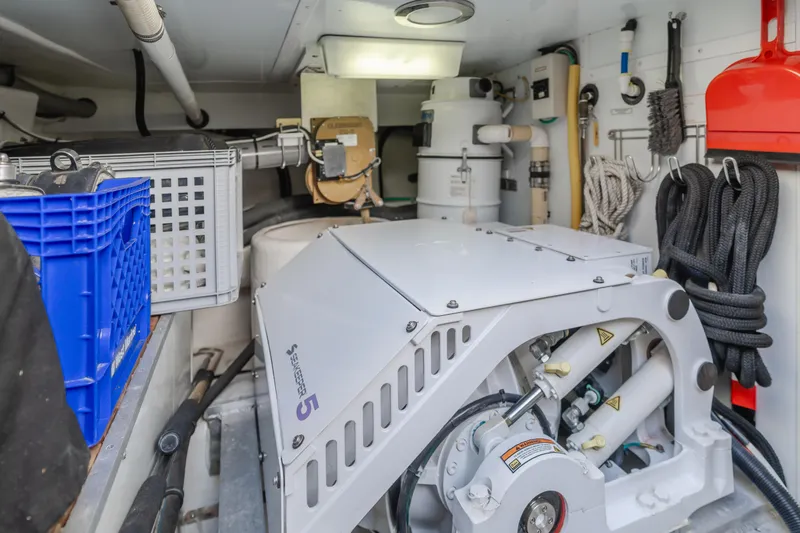 Slide: The Image of Engine room of 2005 Ocean Alexander 548 Pilothouse with equipment and storage. - 18