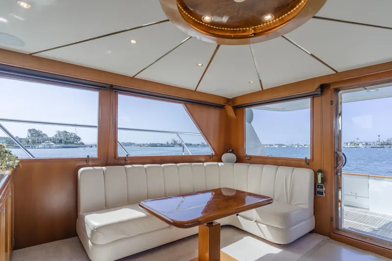 Slide: The Image of Luxurious interior of 2005 Ocean Alexander 548 Pilothouse yacht with elegant seating and table. - 21