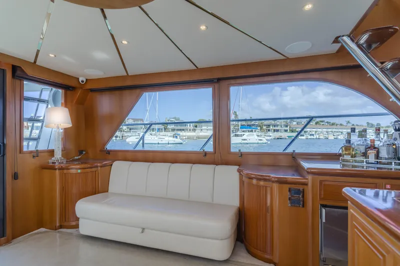 Slide: The Image of Luxurious interior of 2005 Ocean Alexander 548 Pilothouse yacht with marina view. - 23