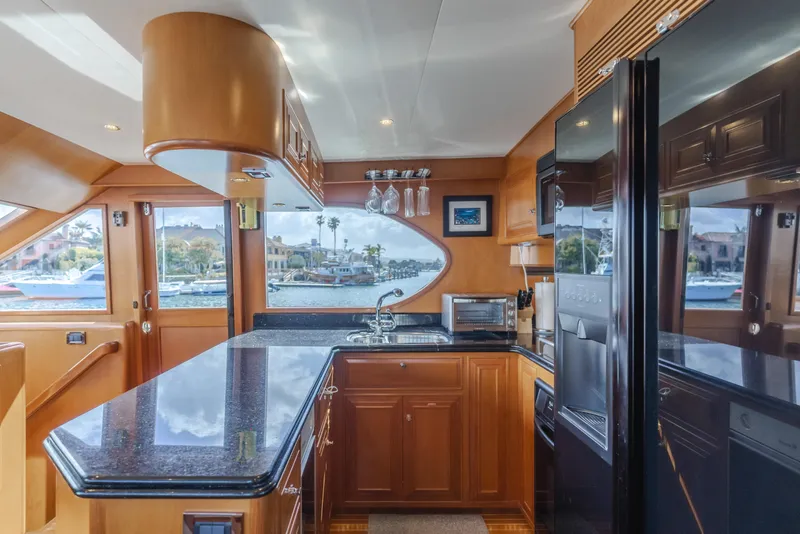 Slide: The Image of Luxurious kitchen interior of 2005 Ocean Alexander 548 Pilothouse yacht with modern amenities. - 25