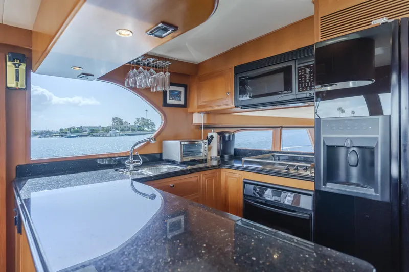 Slide: The Image of Luxurious kitchen in 2005 Ocean Alexander 548 Pilothouse yacht with modern appliances. - 26