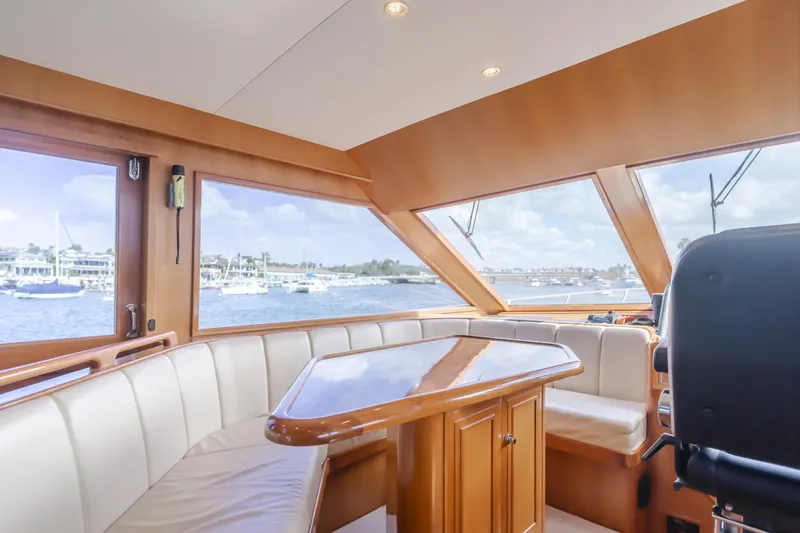 Slide: The Image of Interior of 2005 Ocean Alexander 548 Pilothouse yacht with panoramic windows and seating area. - 28