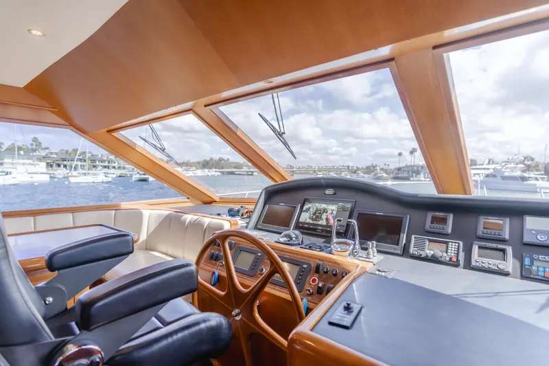 Slide: The Image of Pilothouse interior of 2005 Ocean Alexander 548 yacht with navigation equipment and panoramic windows. - 29