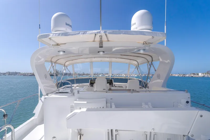 Slide: The Image of 2005 Ocean Alexander 548 Pilothouse yacht with spacious deck and clear blue sky backdrop. - 30
