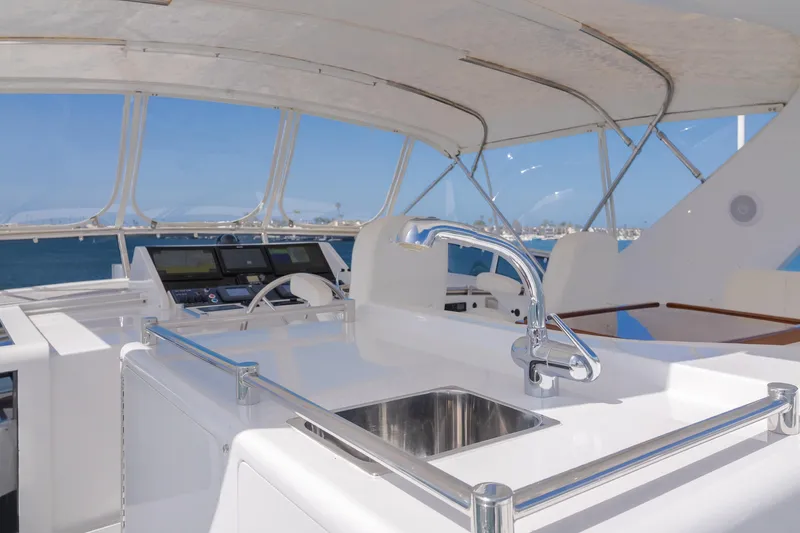 Slide: The Image of 2005 Ocean Alexander 548 Pilothouse yacht interior with sink and helm station. - 31