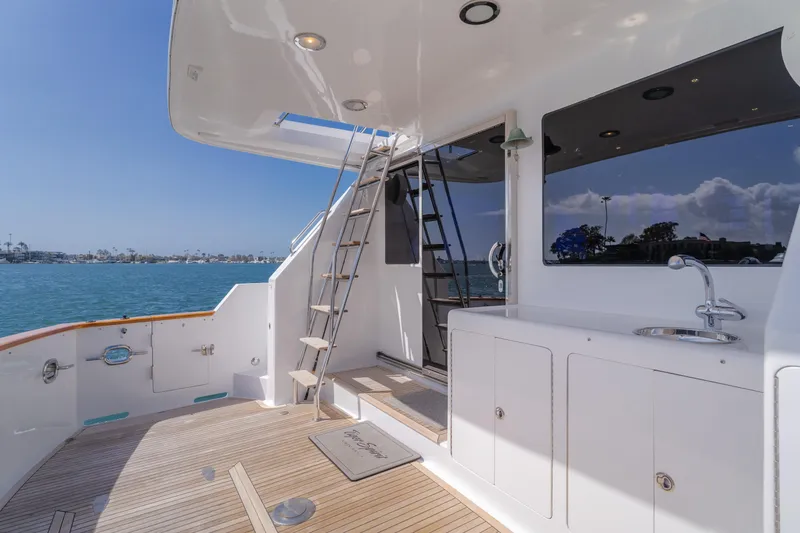 Slide: The Image of 2005 Ocean Alexander 548 Pilothouse yacht deck with ladder and ocean view. - 36