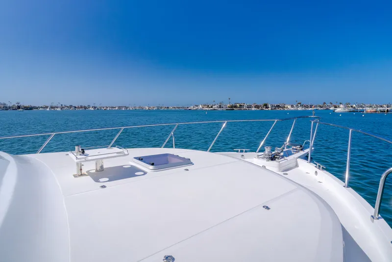 Slide: The Image of Ocean Alexander 548 Pilothouse yacht deck, 2005 model, cruising on a clear blue sea. - 38