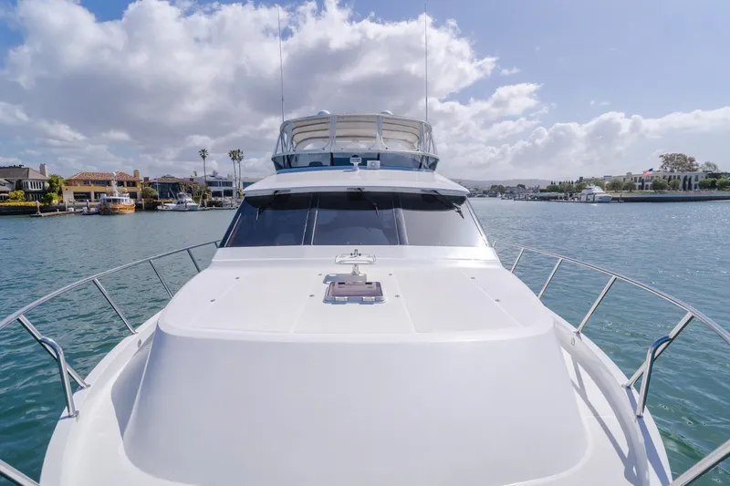 Slide: The Image of 2005 Ocean Alexander 548 Pilothouse yacht on a sunny day, cruising through calm waters. - 39