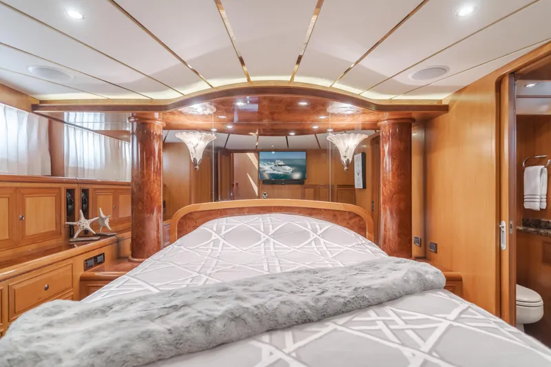 Slide: The Image of Luxurious bedroom interior of 2005 Ocean Alexander 548 Pilothouse yacht with elegant wood finishes. - 40