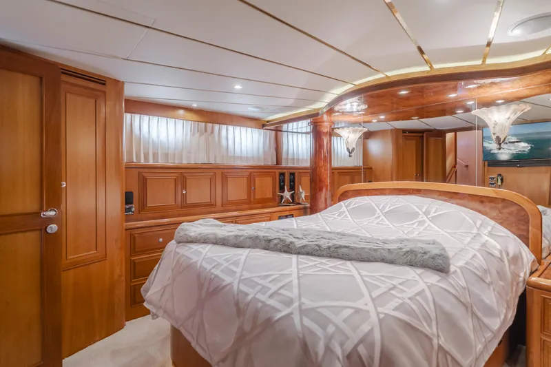 Slide: The Image of Luxurious 2005 Ocean Alexander 548 Pilothouse bedroom with elegant wood finishes. - 42