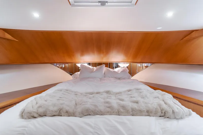Slide: The Image of Luxurious bedroom interior of 2005 Ocean Alexander 548 Pilothouse yacht with plush bedding. - 44