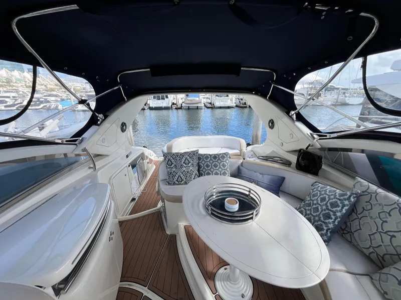 Slide: The Image of Luxurious 2006 Azimut Atlantis yacht interior with elegant seating and marina view. - 13