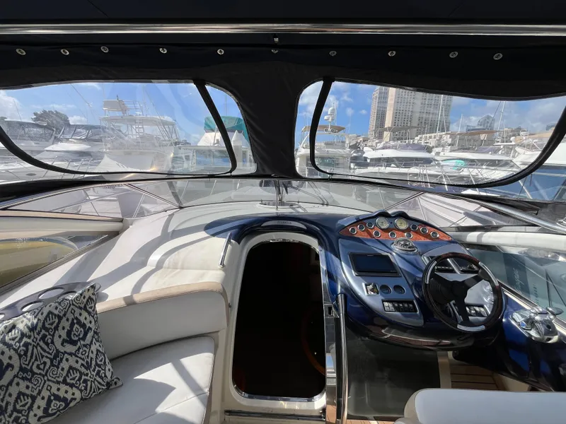 Slide: The Image of Interior view of 2006 Azimut Atlantis yacht cockpit with modern controls and seating. - 18