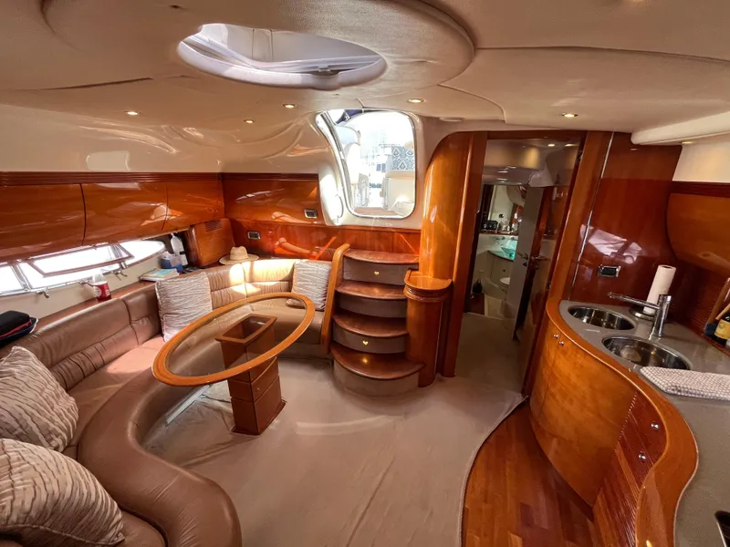 Slide: The Image of Luxurious interior of a 2006 Azimut Atlantis yacht with elegant wood finishes and modern amenities. - 20