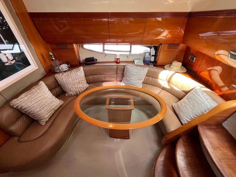 Slide: The Image of Luxurious interior of a 2006 Azimut Atlantis yacht with plush seating and elegant wood finishes. - 22