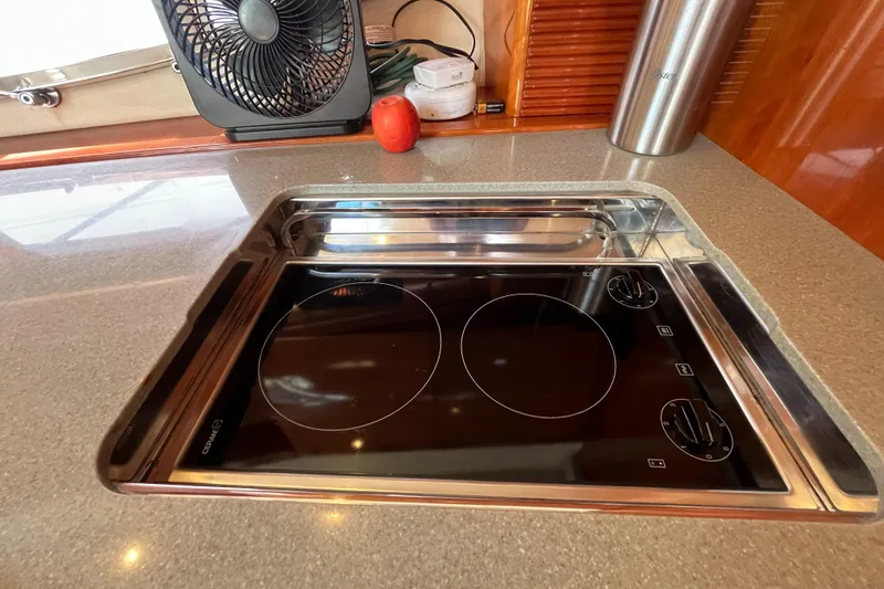 Slide: The Image of Modern stovetop in 2006 Azimut Atlantis yacht kitchen with sleek design. - 25