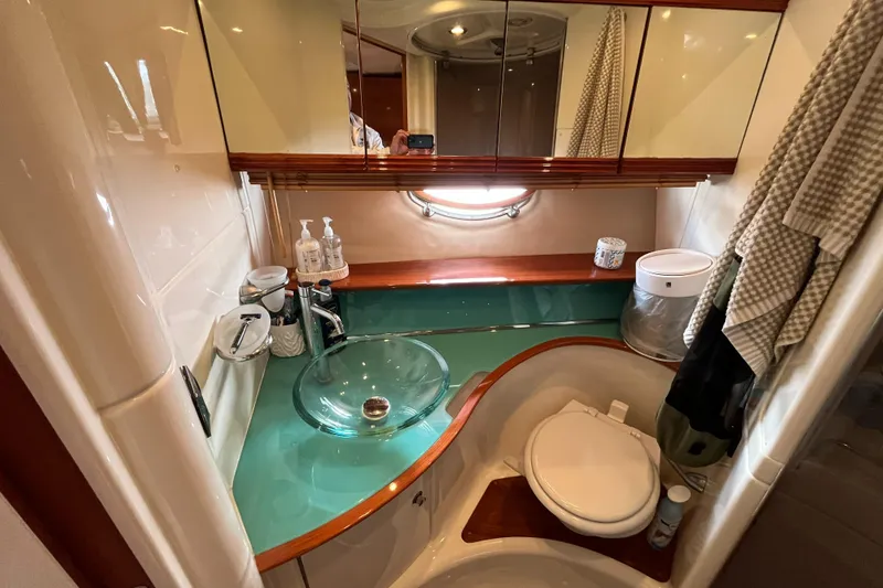 Slide: The Image of Luxurious 2006 Azimut Atlantis yacht bathroom with glass sink and modern fixtures. - 31