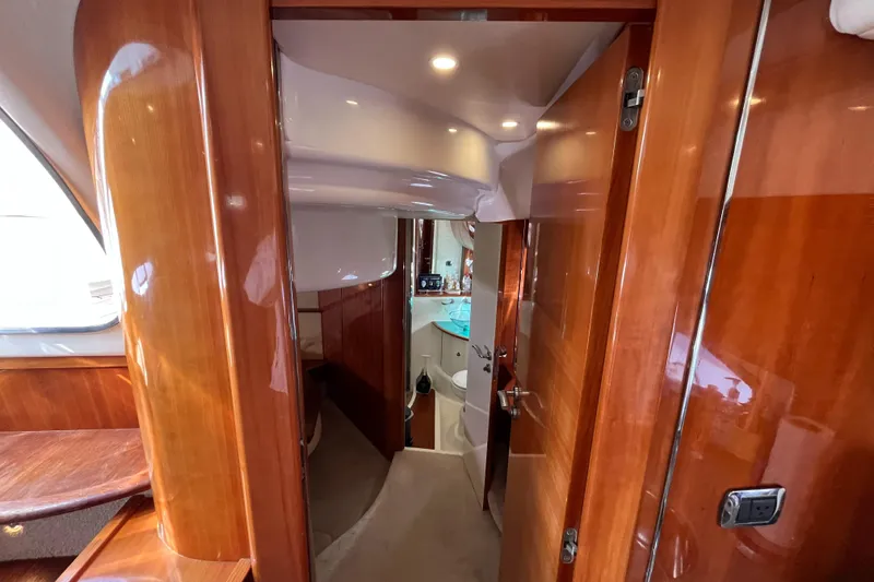Slide: The Image of Luxurious interior of a 2006 Azimut Atlantis yacht with polished wood finishes. - 34