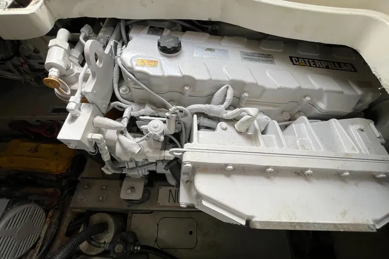 Slide: The Image of Engine compartment of a 2006 Azimut Atlantis yacht featuring a Caterpillar engine. - 43