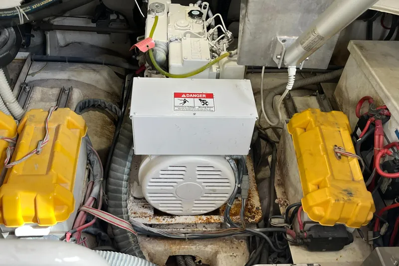 Slide: The Image of Engine compartment of a 2006 Azimut Atlantis boat, featuring batteries and electrical components. - 45