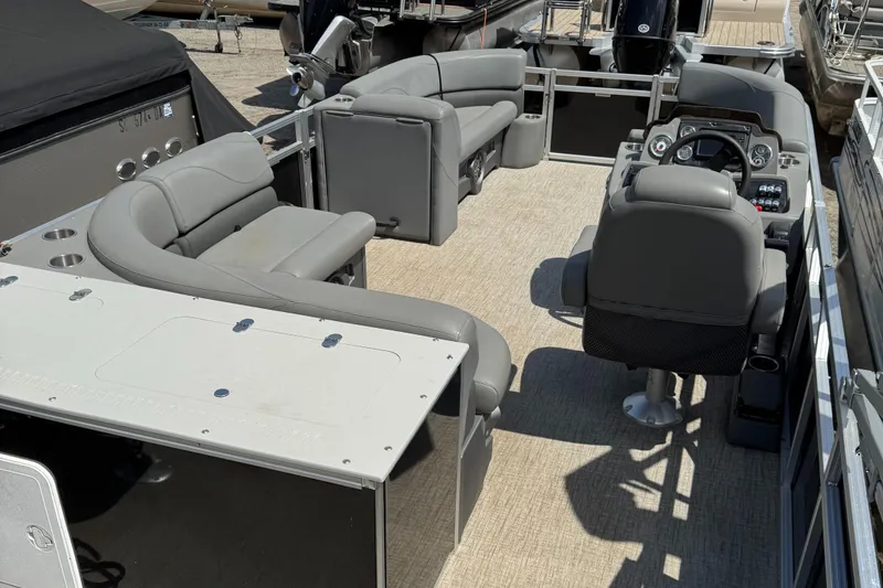 Slide: The Image of 2022 Tahoe Pontoon GT Fish interior with gray seating and steering console. - 3