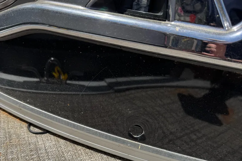 Slide: The Image of 2022 Tahoe Pontoon GT Fish boat exterior detail with sleek black finish. - 7