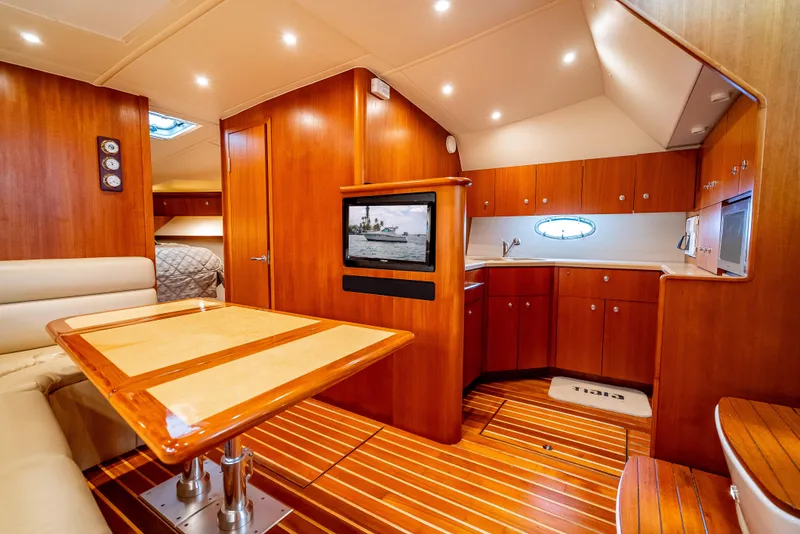 Slide: The Image of Luxurious 2005 Tiara Yachts 4200 Open interior with wood finish and modern amenities. - 18