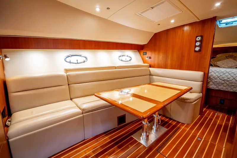 Slide: The Image of Luxurious interior of 2005 Tiara Yachts 4200 Open with elegant seating and wooden accents. - 20