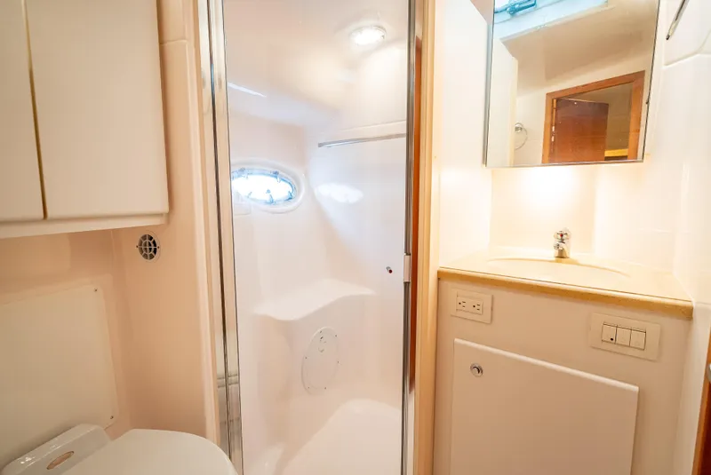Slide: The Image of Bathroom interior of 2005 Tiara Yachts 4200 Open, featuring modern fixtures and lighting. - 22