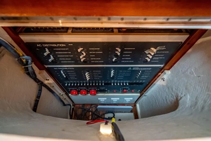 Slide: The Image of Electrical panel of a 2005 Tiara Yachts 4200 Open, featuring AC distribution controls. - 23