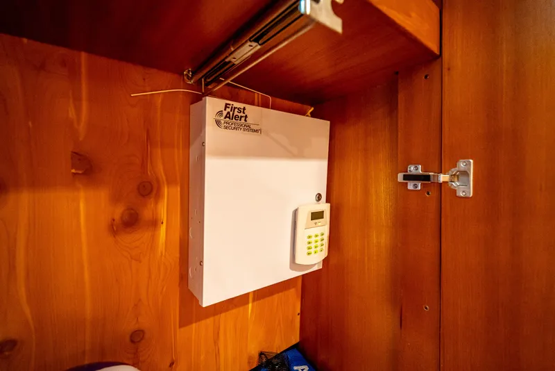 Slide: The Image of Security system inside a wooden cabinet on a 2005 Tiara Yachts 4200 Open. - 24