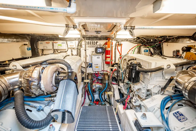 Slide: The Image of Engine room of 2005 Tiara Yachts 4200 Open, showcasing dual engines and mechanical systems. - 25