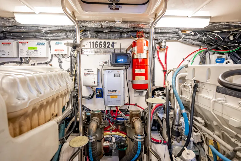 Slide: The Image of Engine room of 2005 Tiara Yachts 4200 Open, featuring equipment and wiring. - 28