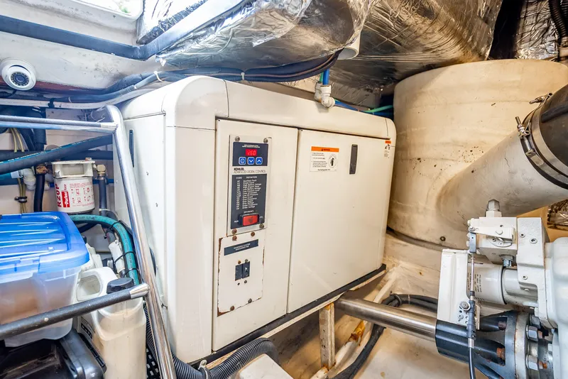 Slide: The Image of Engine room of 2005 Tiara Yachts 4200 Open, featuring control panel and machinery. - 29