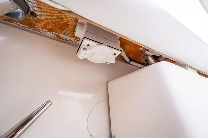 Slide: The Image of 2005 Tiara Yachts 4200 Open interior detail, showcasing electrical outlet and structural components. - 31