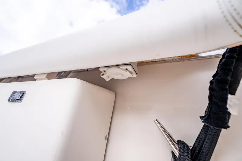 Slide: The Image of 2005 Tiara Yachts 4200 Open boat detail, featuring deck hardware and rope cleat. - 32